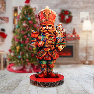 a wooden statue of a nutcracker holding a nutcracker