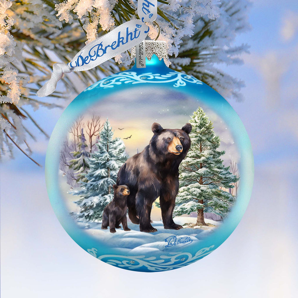 a christmas ornament with a bear and cub on it