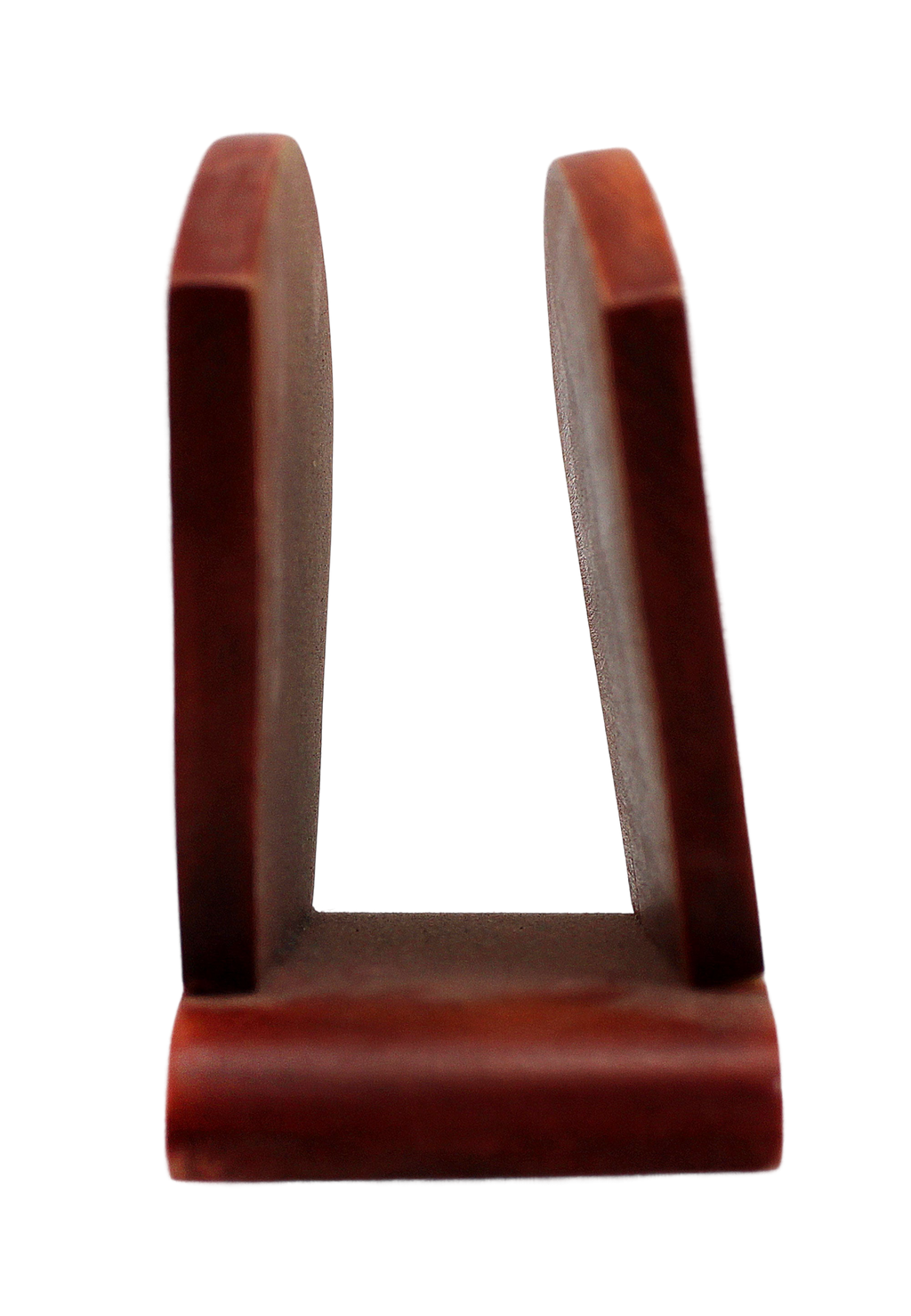 A red wooden object with a curved shape, standing upright against a black background.
