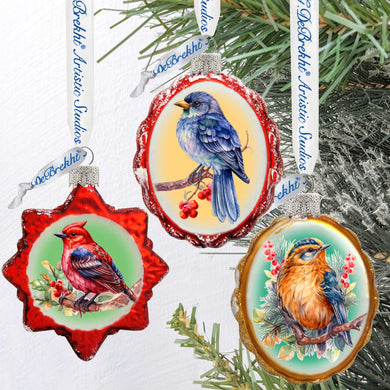 three ornaments hanging from a christmas tree