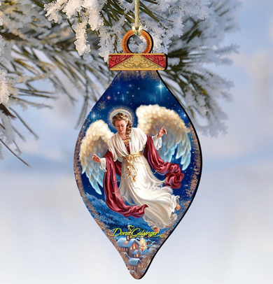 A decorative ornament featuring an angel with outstretched wings, set against a snowy background.