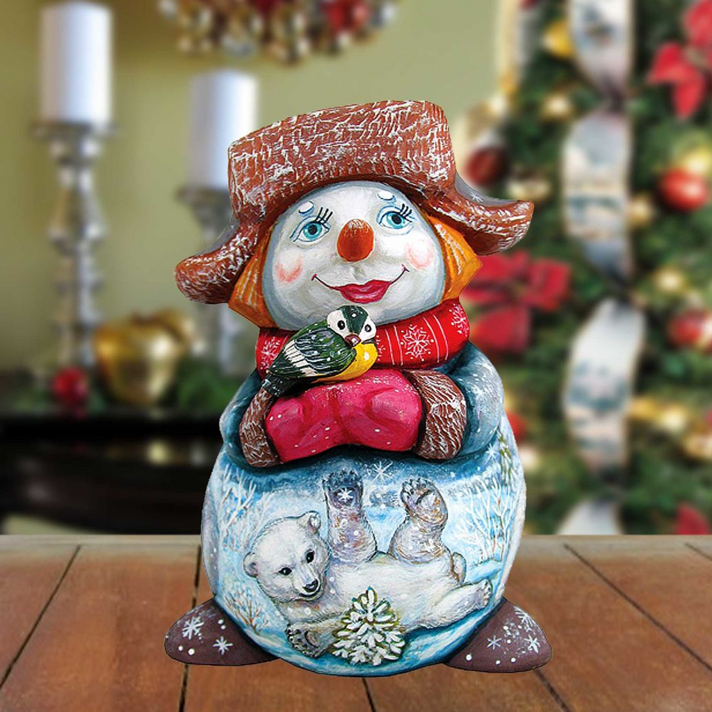 A colorful snowman figurine with a bird perched on its shoulder, set against a blurred background of Christmas decorations.