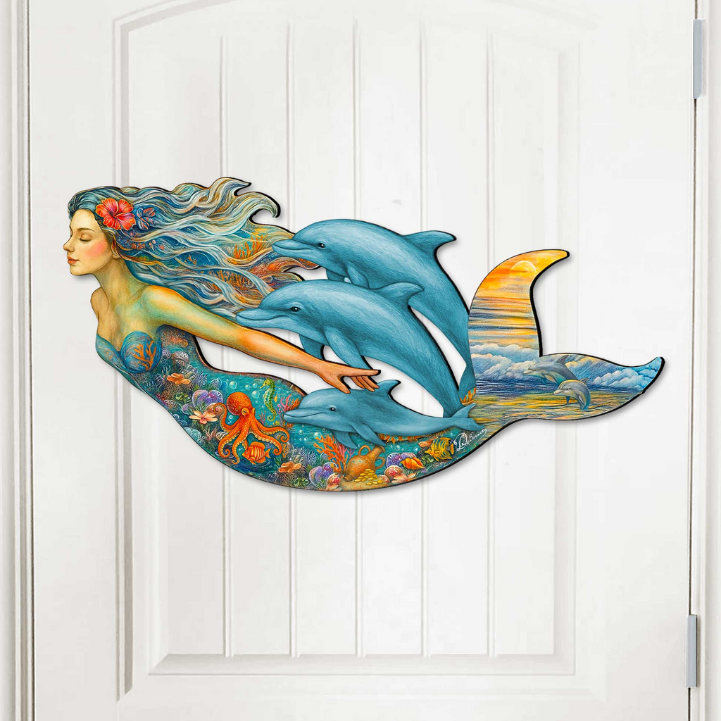 Colorful mermaid wall art with dolphins and ocean life, handcrafted by GDebrekht Artistic Studio. Features vibrant undersea details, flowing hair, and a sunset dolphin tail, perfect for coastal wall decor, nautical door art, or beach house decoration. Ideal for ocean lovers seeking unique gifts or coastal door decorations. Made in the USA for indoor or outdoor display.