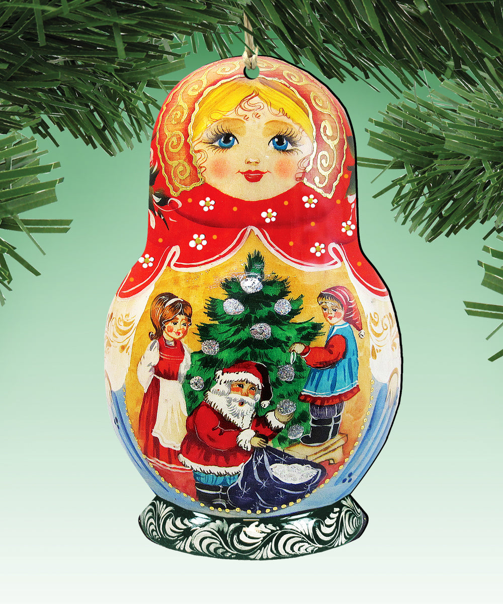 A colorful ornament featuring a Christmas tree with Santa Claus, two children, and a woman, all set against a green background.