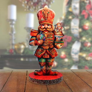 a wooden figurine of a nutcracker holding a nutcracker
