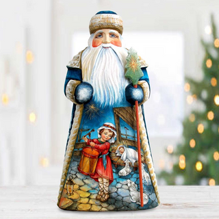 A colorful figurine of Santa Claus holding a nativity scene, with a young girl playing the flute and a baby Jesus in the manger.