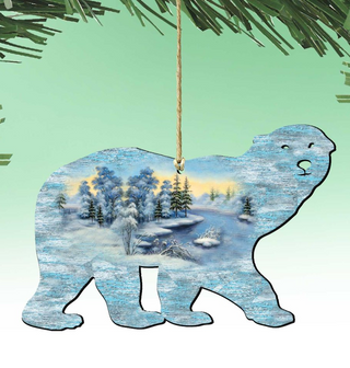 A silhouette of a polar bear is hanging from a string, with a winter landscape scene depicted inside the bear's body.
