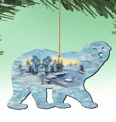 A silhouette of a polar bear is hanging from a string, with a winter landscape scene depicted inside the bear's body.