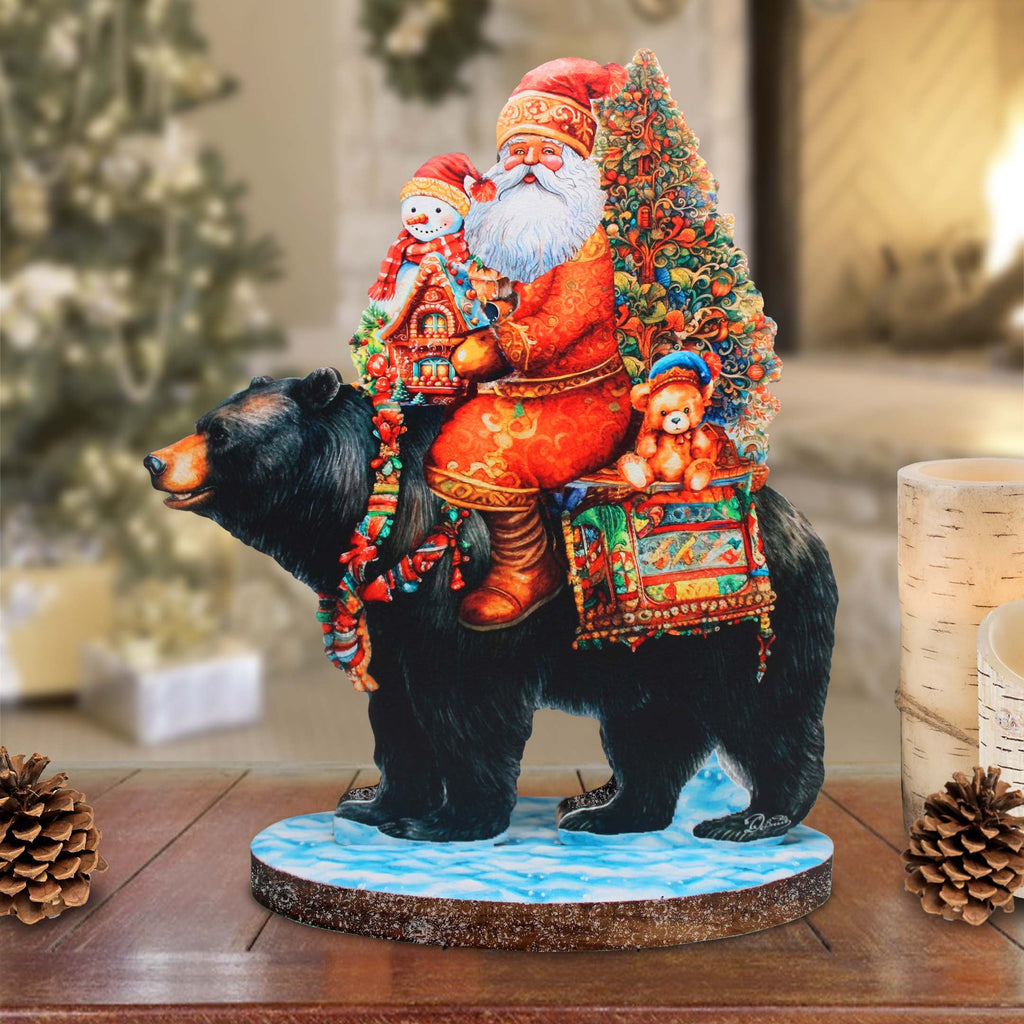 a figurine of santa claus riding a bear