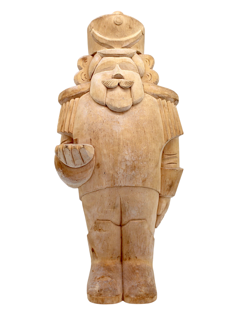A wooden nutcracker figure with a hat and a bowl in its hand, standing against a black background.