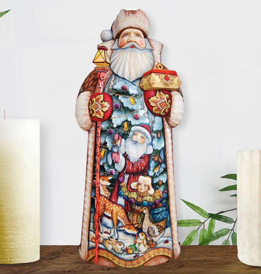 A colorful and detailed sculpture of Santa Claus, with various holiday-themed elements such as reindeer, snowmen, and Christmas trees.