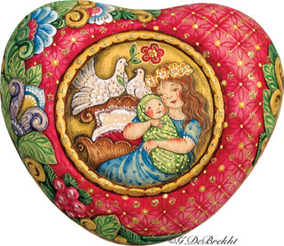 A heart-shaped wooden plaque with a painting of a woman holding a baby, surrounded by flowers and birds.