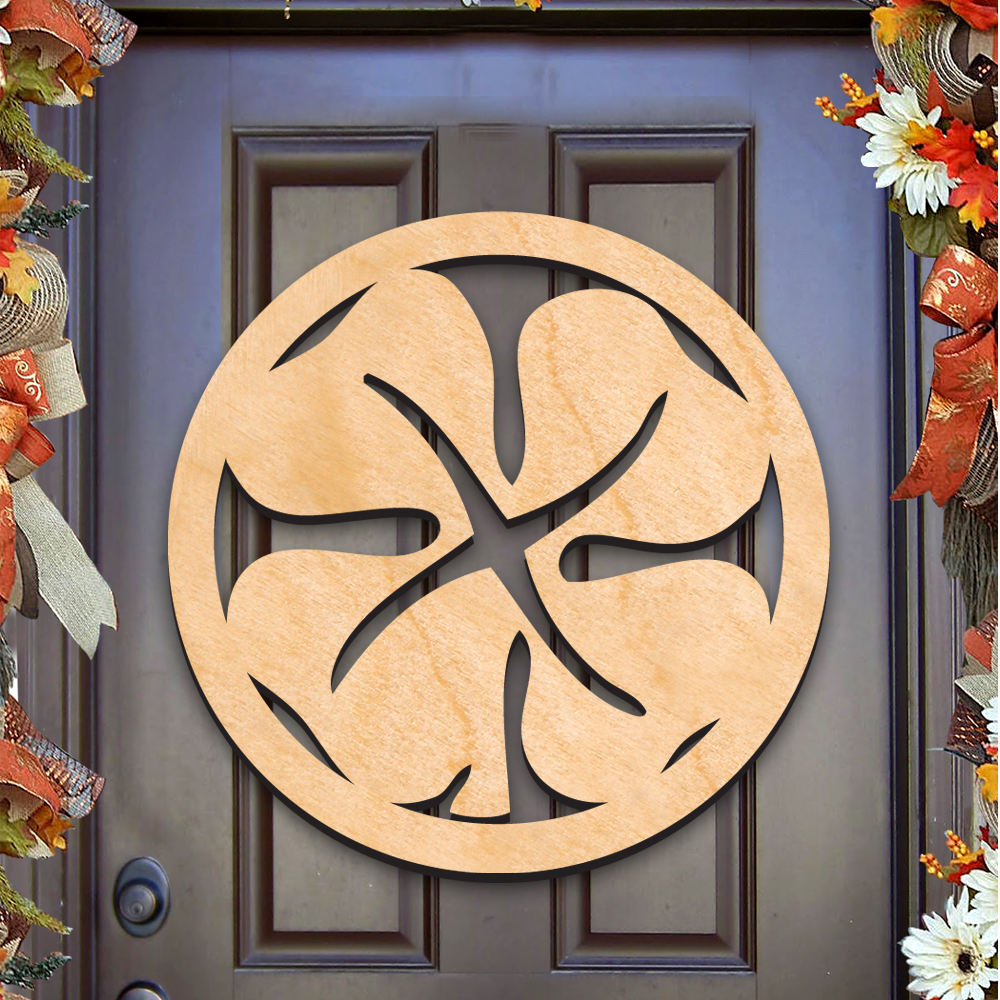 a wooden door with a circular cutout in the center, surrounded by a wreath of autumn flowers.