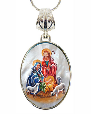 A necklace pendant featuring a religious scene with a nativity scene, including the Virgin Mary, baby Jesus, and the wise men.