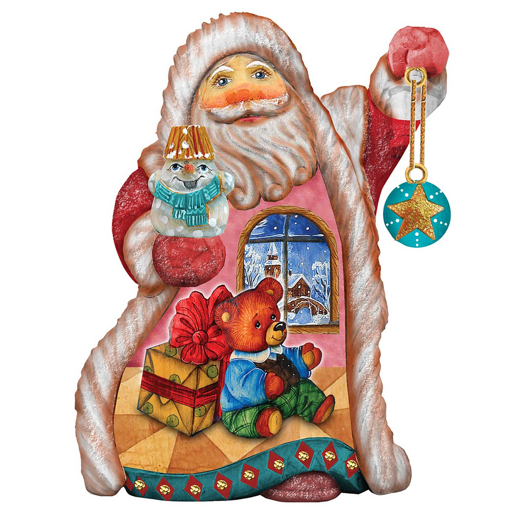 A colorful and whimsical Christmas ornament depicting Santa Claus holding a snowman, a teddy bear, and a gift box, with a star decoration hanging from Santa's hand.