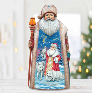 A figurine of Santa Claus holding a lantern and a bird, set against a snowy winter landscape with a wolf and a wolf cub.