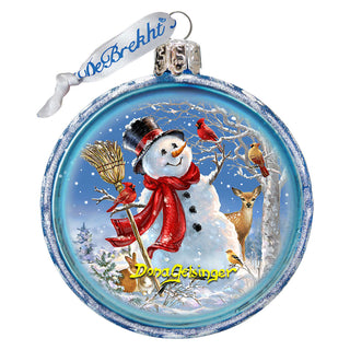 a glass ornament with a snowman holding a broom
