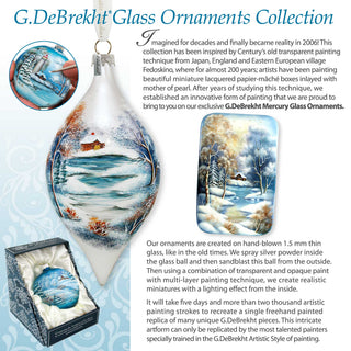 a glass ornament with a snowy scene on it