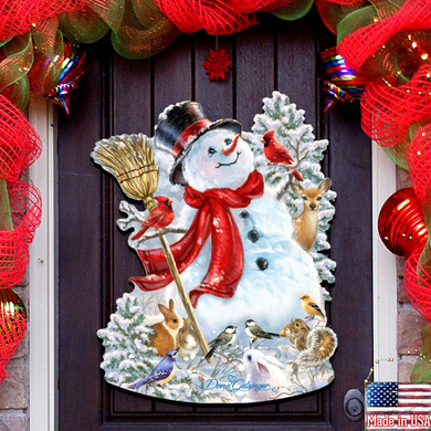 A snowman decoration with a red scarf, a broom, and various woodland animals, including a bird, is displayed on a dark wooden door.