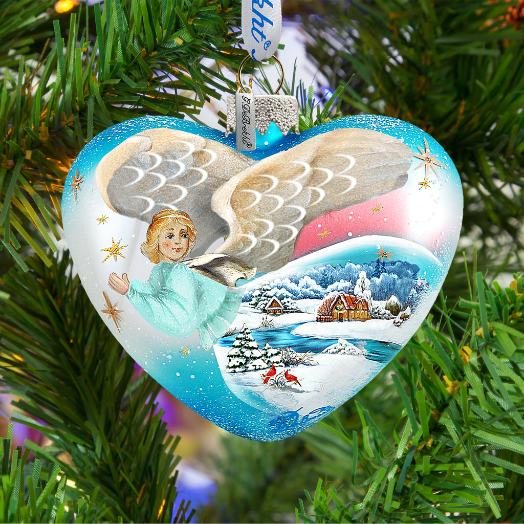 a heart shaped ornament hanging from a christmas tree