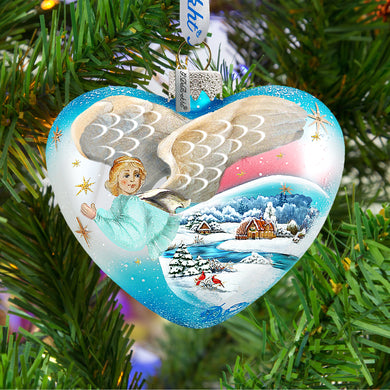 a heart shaped ornament hanging from a christmas tree
