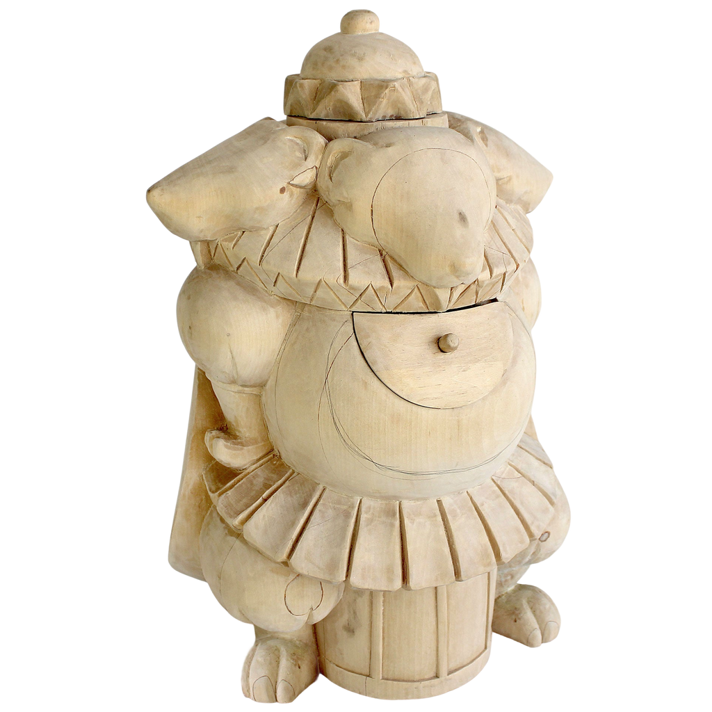 A wooden sculpture of a whimsical, anthropomorphic animal with a hat and a large, round object on its back.