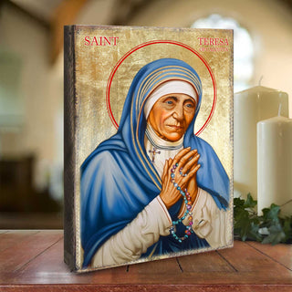 a religious icon featuring the Virgin Mary, with a focus on her hands and the rosary she holds.