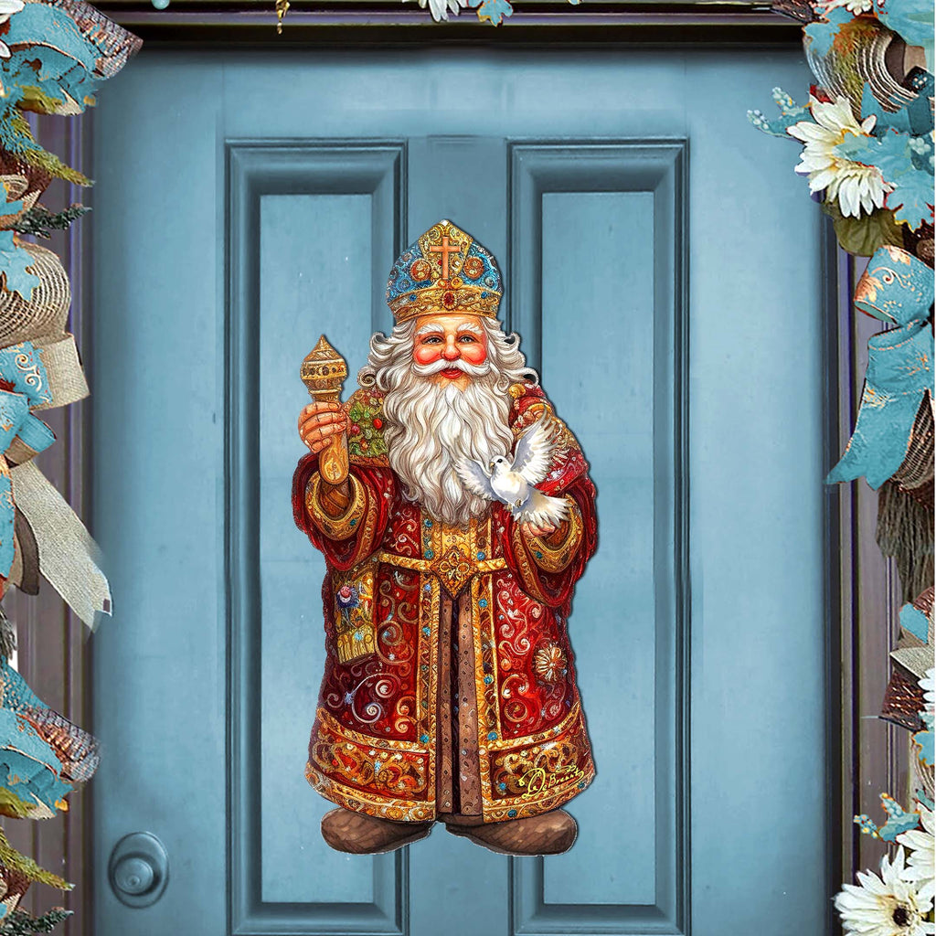 a blue door with a statue of santa claus on it