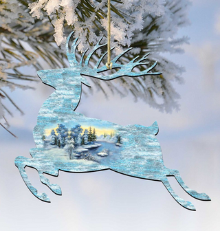 A decorative ornament in the shape of a deer, with a snowy winter landscape visible through its body.