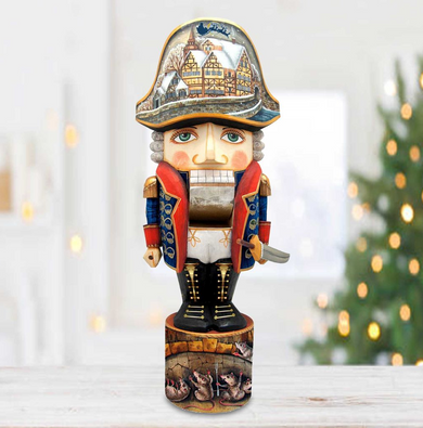 A nutcracker figurine with a detailed design, including a hat and a castle-like background, is displayed on a wooden surface.