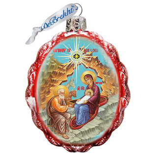 A decorative ornament featuring a religious scene with a nativity scene, including the Virgin Mary, baby Jesus, and the saints.