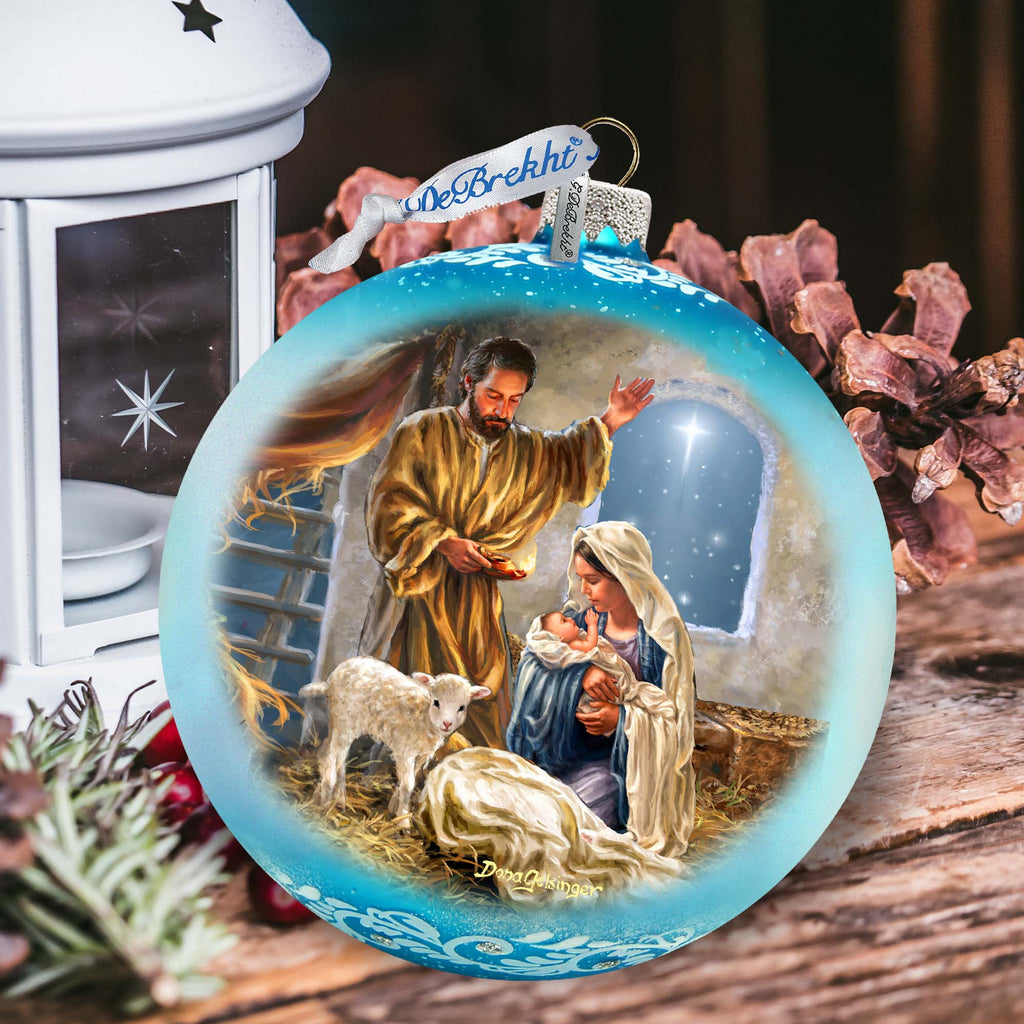 a christmas ornament with a nativity scene on it