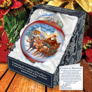 a christmas ornament with santa riding a sleigh