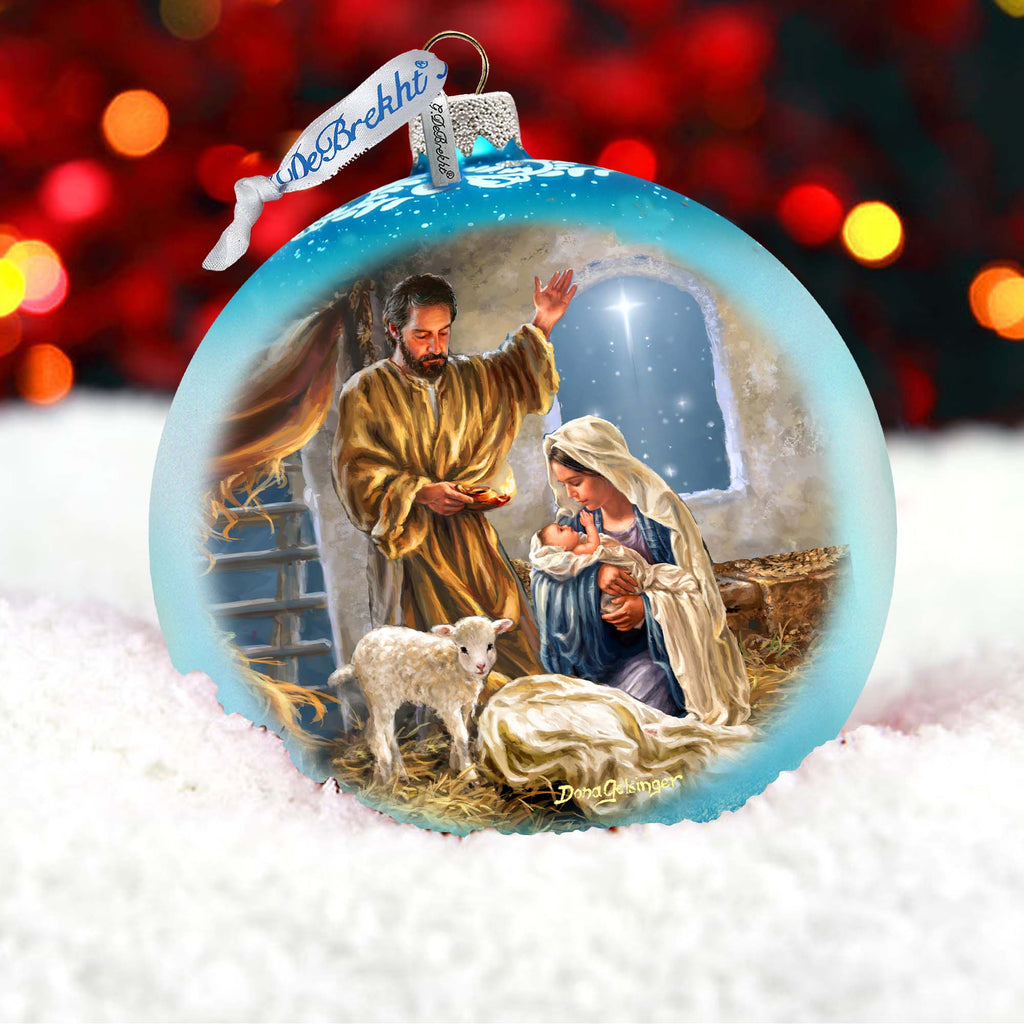 a glass ornament with a nativity scene inside of it