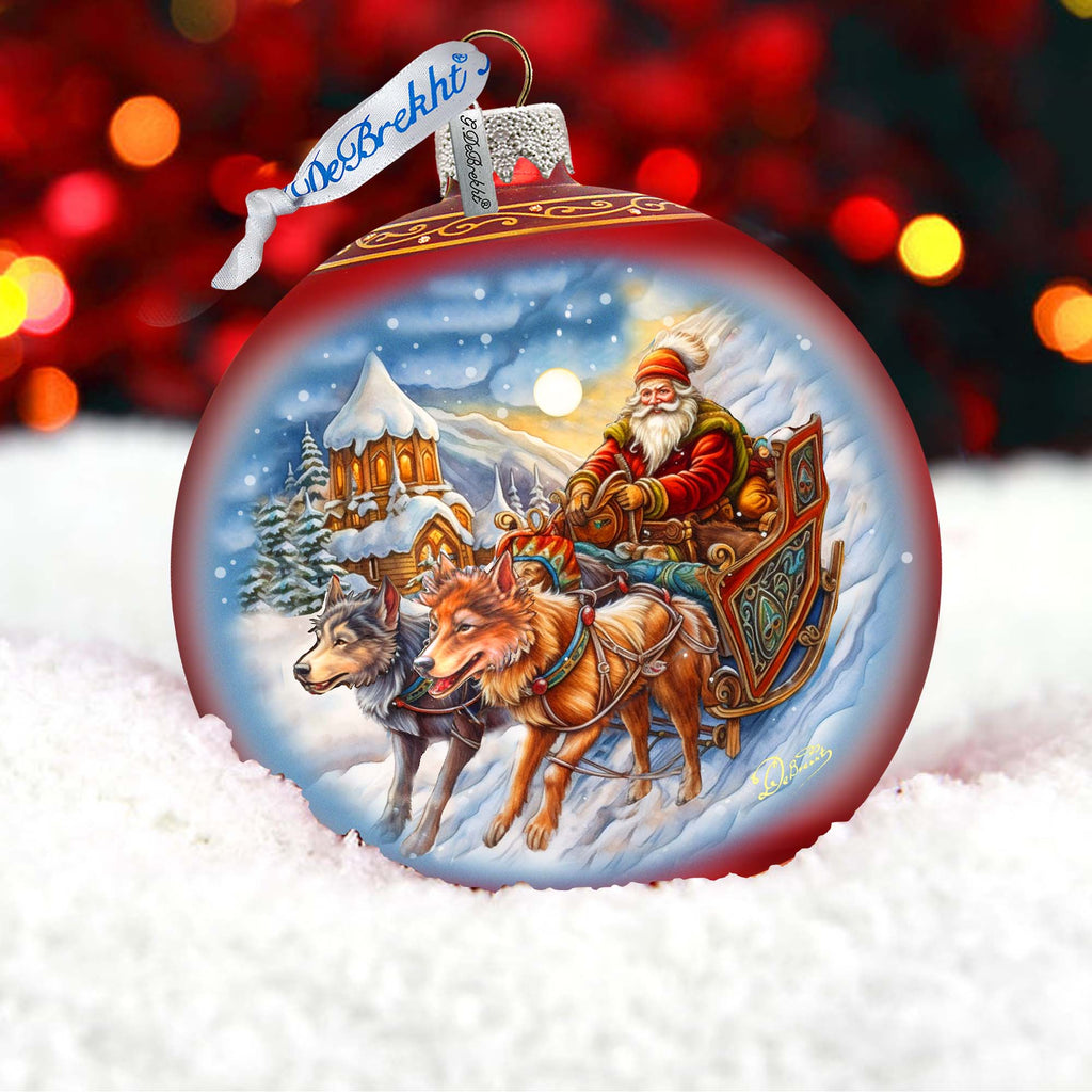 a christmas ornament with a santa on a sleigh