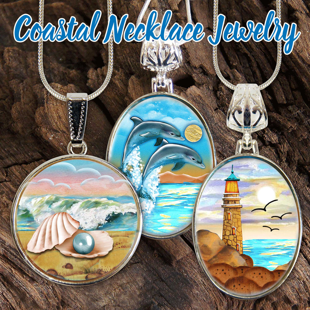 three circular necklaces with different coastal scenes, including a shell, a lighthouse, and a sunset over the ocean.