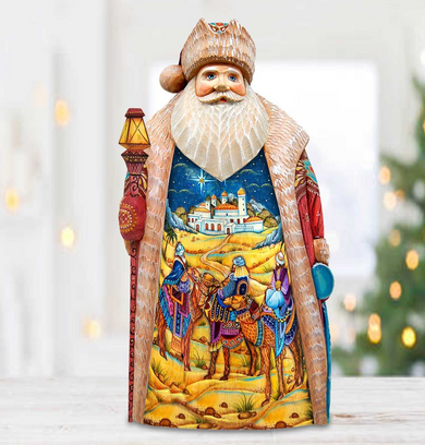 A colorful and detailed figurine of Santa Claus, with intricate designs and patterns depicting a nativity scene.