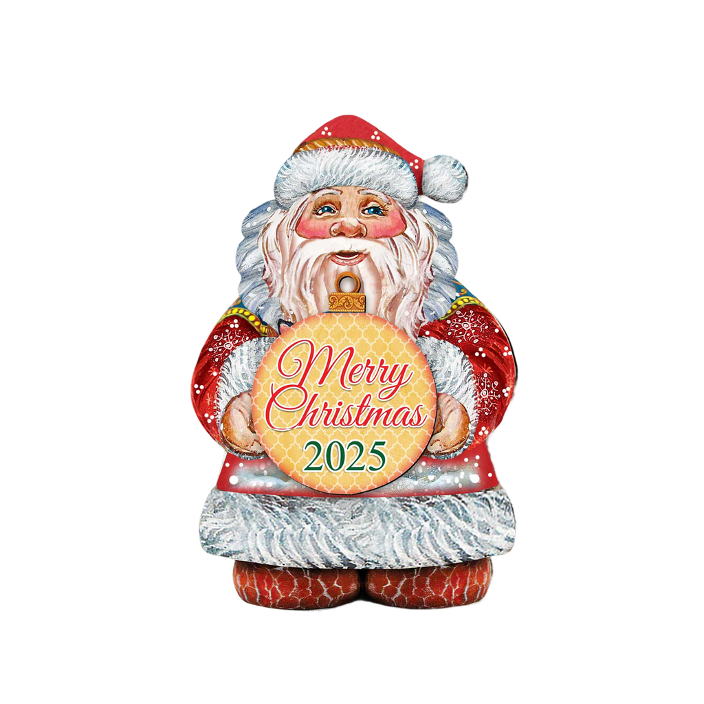 A colorful, hand-painted Santa Claus figure holding a sign that says 