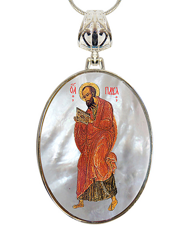 a pendant with a religious icon of a saint, possibly a Christian figure, wearing a red robe and holding a book.