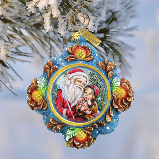 A decorative ornament featuring a painting of Santa Claus and a young girl, hanging on a tree branch with snow on the branches.
