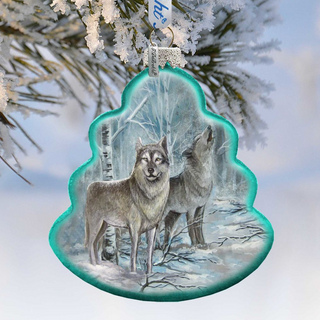A decorative ornament featuring two wolves in a snowy forest setting, with a blue and green color scheme.