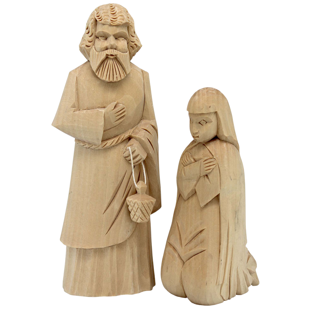 Two wooden carved figures, a bearded man and a kneeling woman, are depicted in the image.
