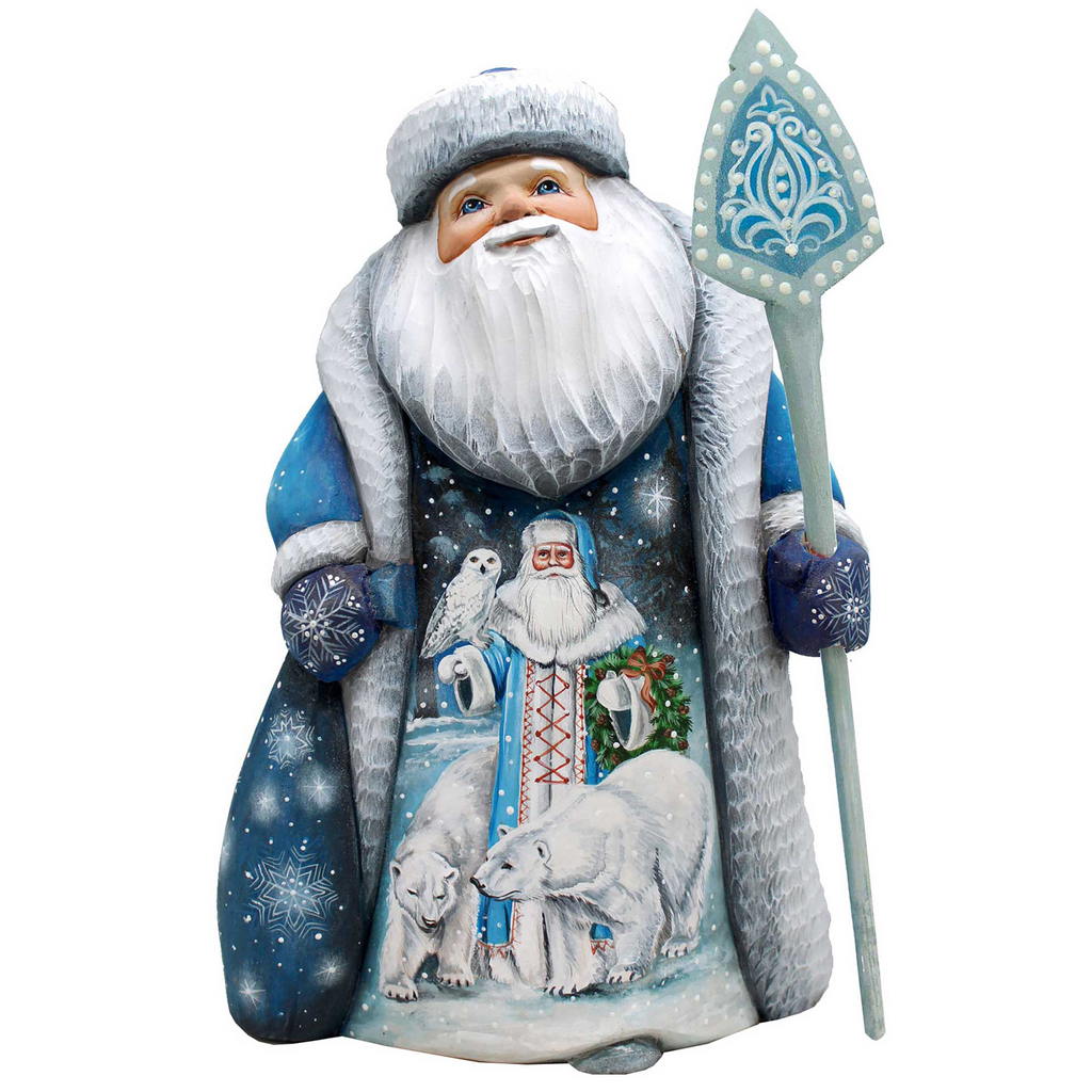 A figurine of Santa Claus holding a snowflake-patterned staff and wearing a blue and white outfit with a snowy landscape and polar bears on it.