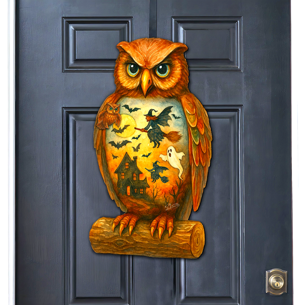 A large owl-shaped door decoration with a Halloween-themed design, featuring bats, a witch, and a ghost.