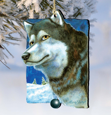 A wooden ornament depicting a wolf's head, with a snowy landscape in the background.