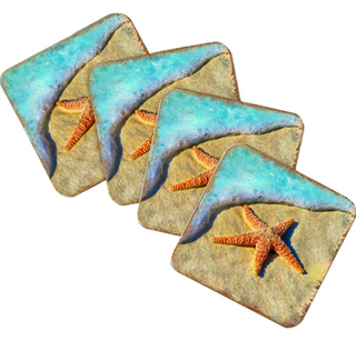 three square coasters with a beach scene design, featuring a starfish and a wave.