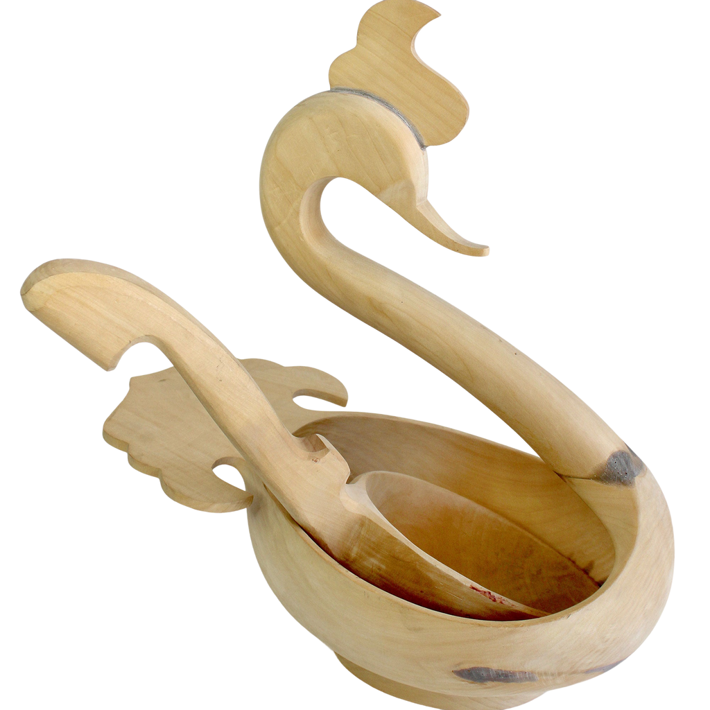 A wooden sculpture of a swan, with a curved neck and long beak, is displayed against a white background.