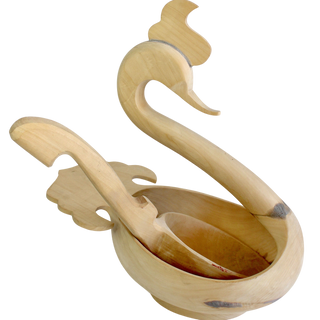 A wooden sculpture of a swan, with a curved neck and long beak, is displayed against a white background.