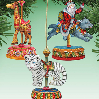 a collection of colorful and whimsical ornaments, including a giraffe, a carousel figure, a tiger, and a Santa Claus figure, all hanging from a tree branch.
