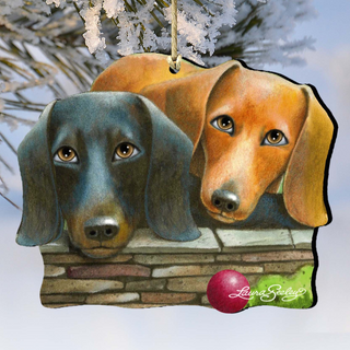 A wooden ornament depicting two dachshund dogs, one black and one brown, sitting together on a brick wall.
